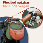 Braune Moonbag Wickeltasche mit Leoprint am Kinderwagen befestigt