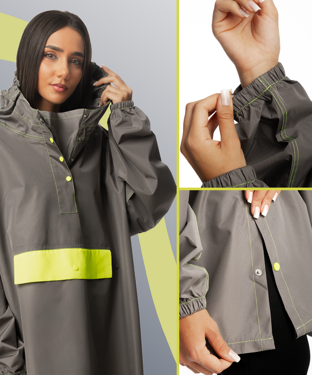 Grauer Regenponcho für Damen beim Fahrradfahren